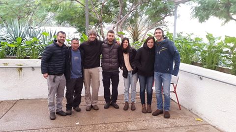 Image may contain: 7 people, people smiling, people standing, tree and outdoor